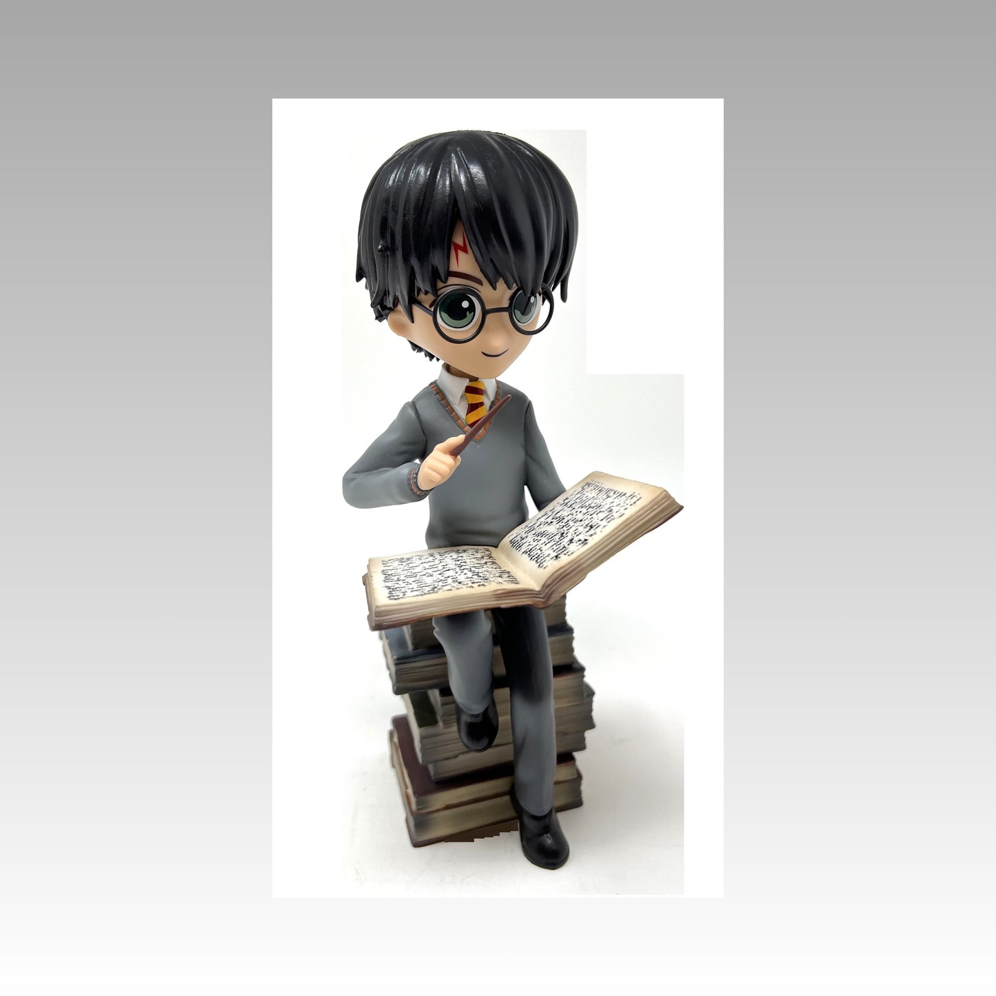 Figurine Harry Potter pile de grimoires