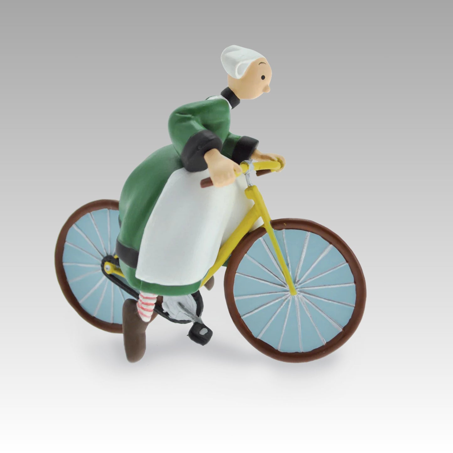Figurine Bécassine à vélo