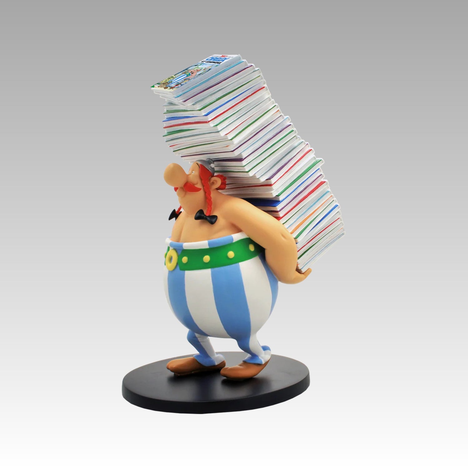 Figurine Obélix pile d'albums