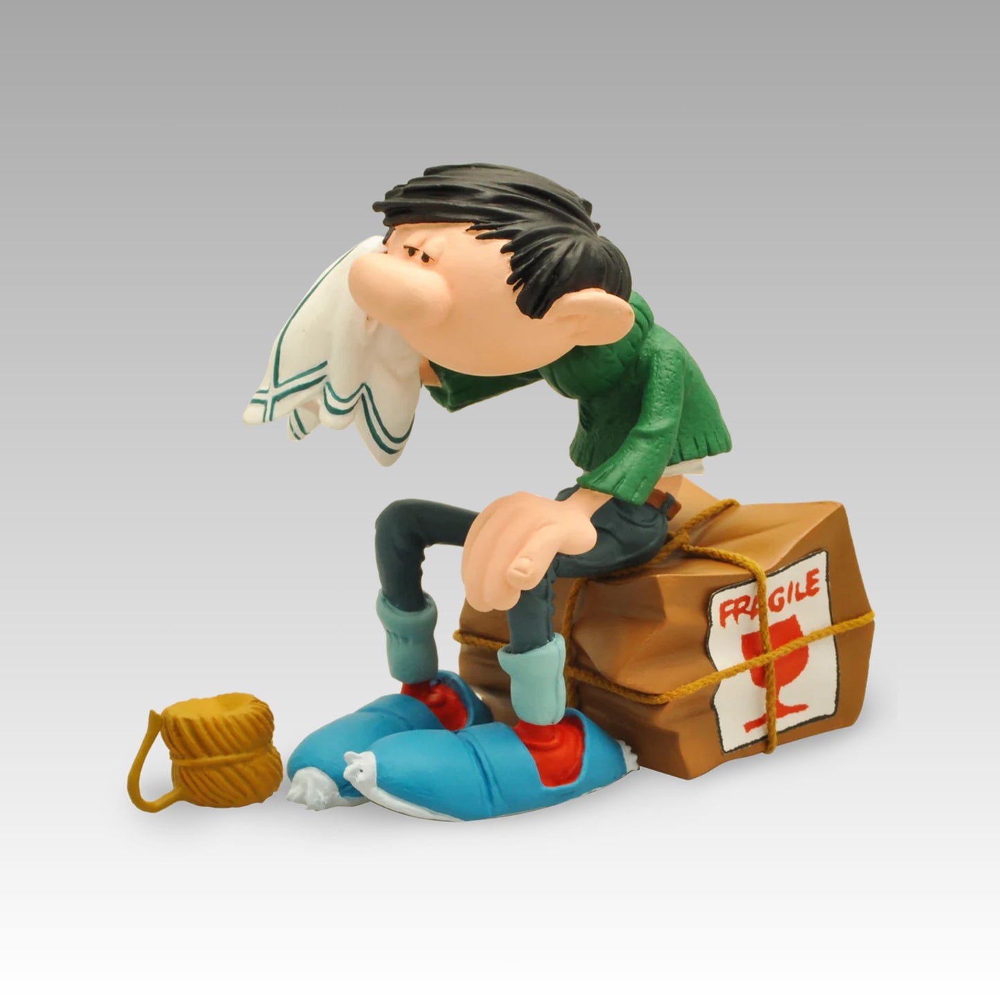 Figurine Gaston caisse fragile