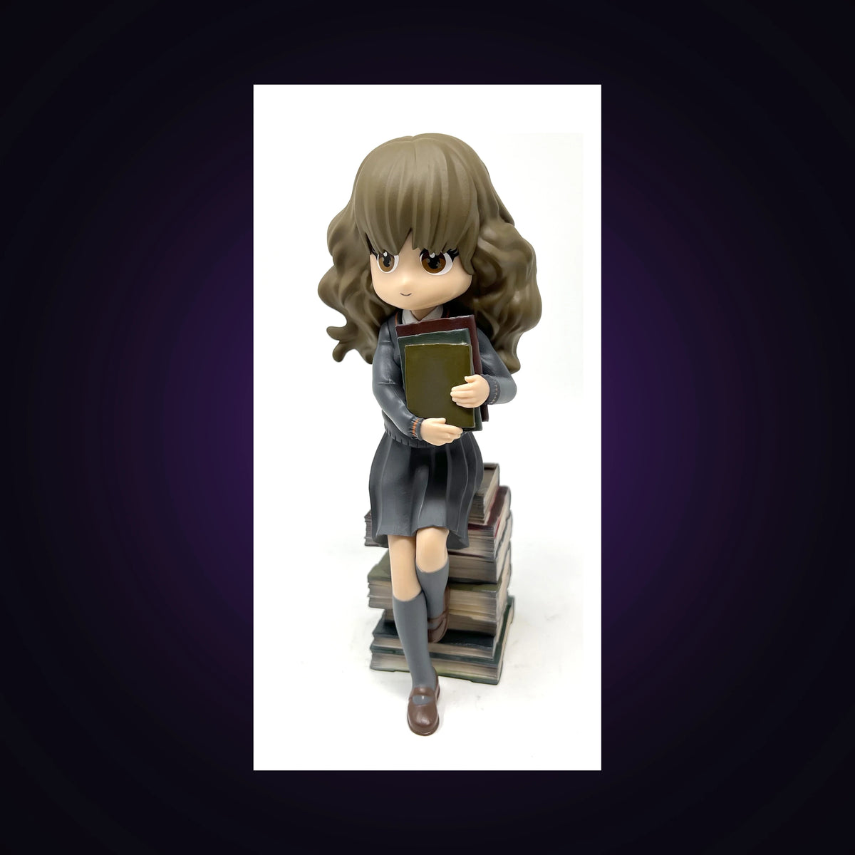 Figurine Hermione pile de grimoires
