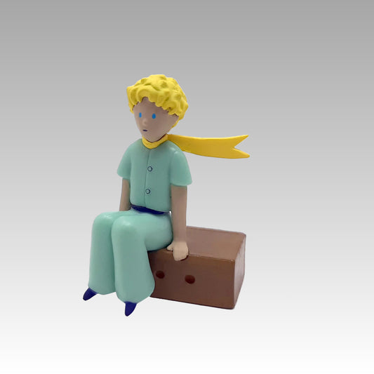 Figurine le Petit Prince sur sa caisse