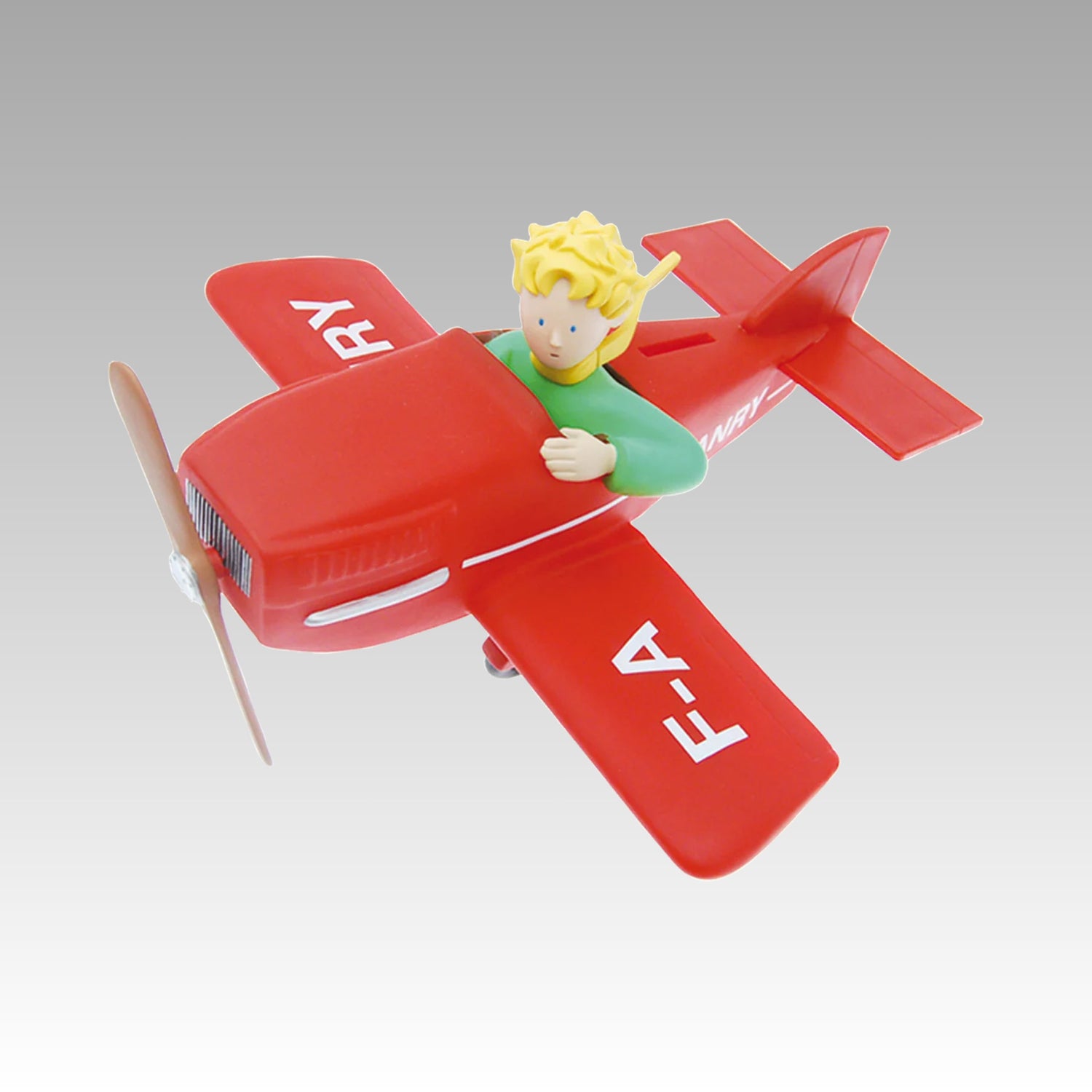 Tirelire le Petit Prince dans son avion